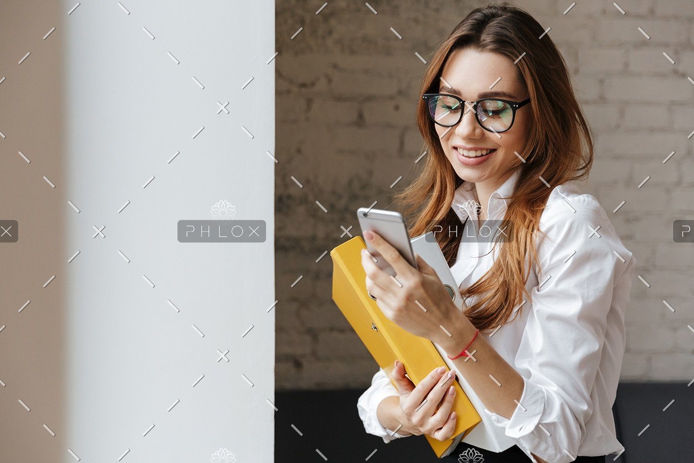 demo-attachment-175-happy-business-woman-indoors-using-mobile-phone-P9WS3SD